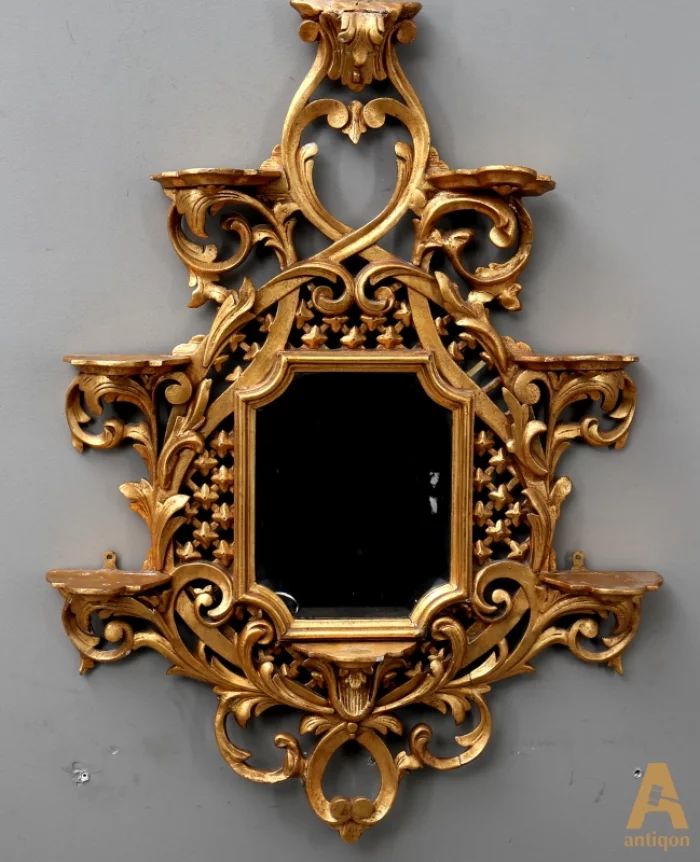 Mirror with decorative consoles