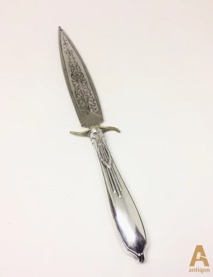 Silver knife for letters.