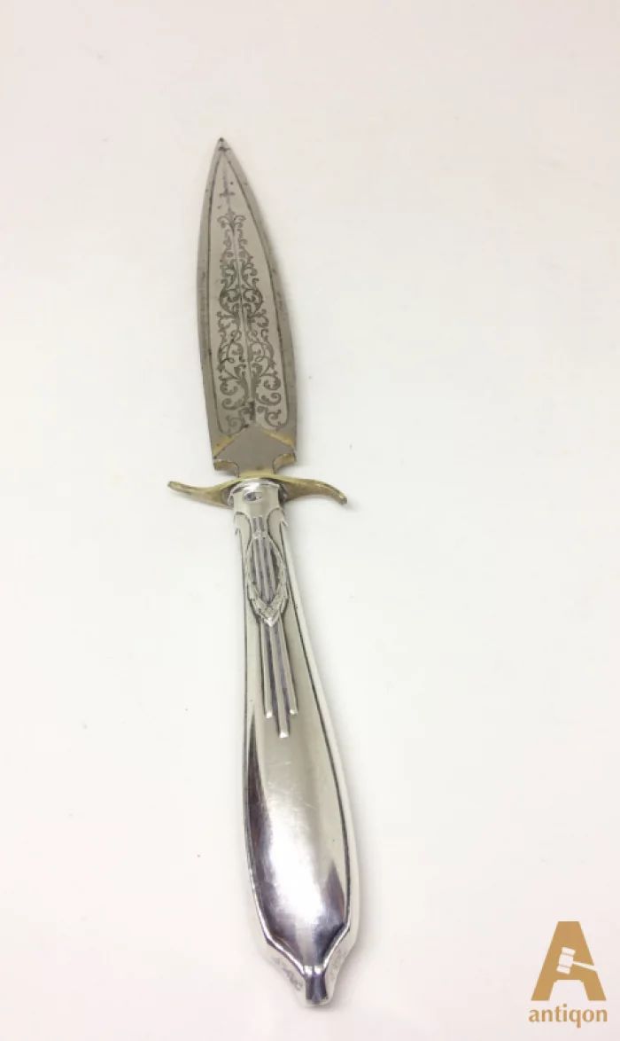 Silver knife for letters.