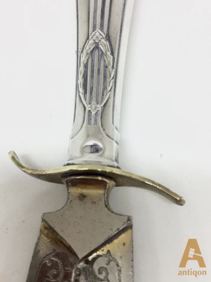 Silver knife for letters.