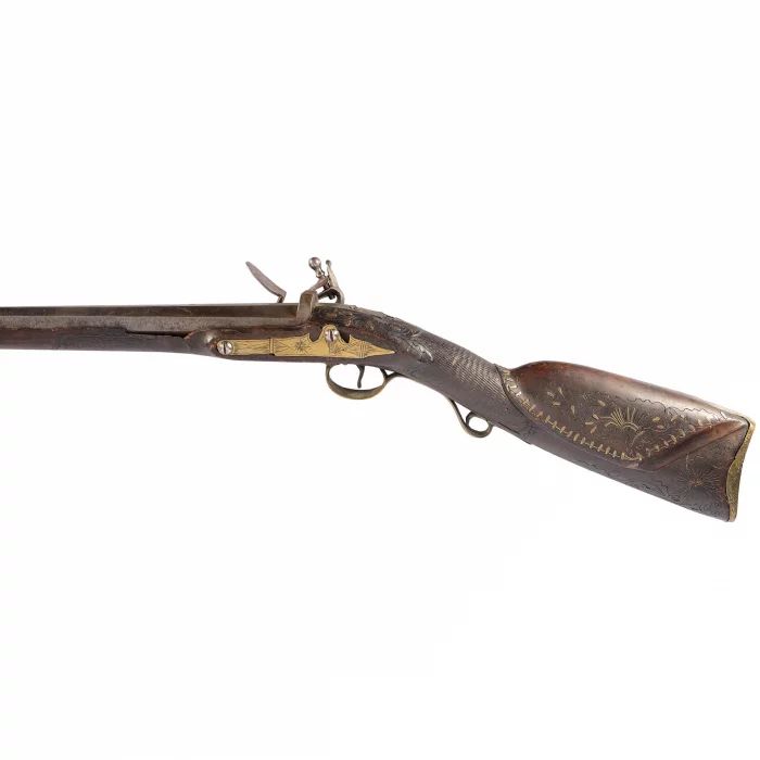 A long-barreled hunting rifle