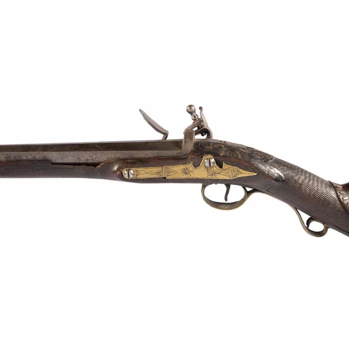 A long-barreled hunting rifle