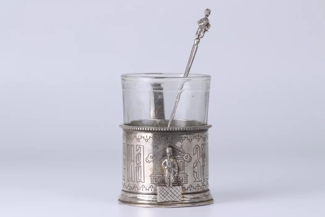 Russian silver cup holder with a slogan. 