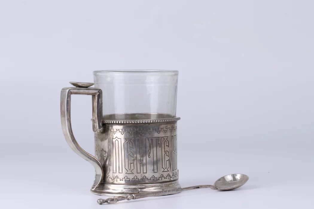 Russian silver cup holder with a slogan. 