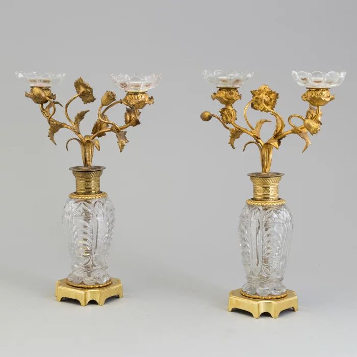 Pair of gilded brass-bronze candlesticks "Flowers" on crystal columns. 