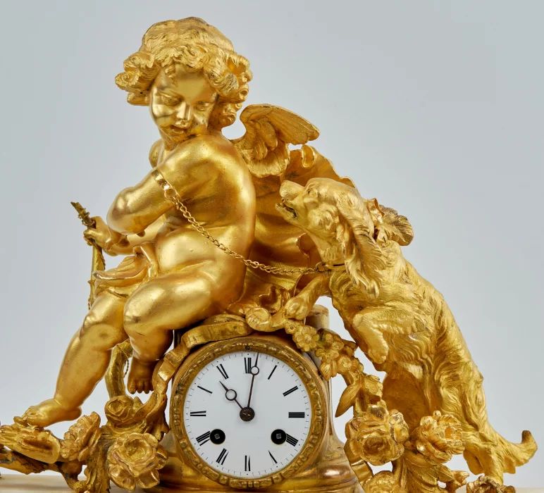 Phillipe Mourey. Mantel clock Putti with a dog. 