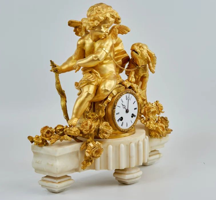 Phillipe Mourey. Mantel clock Putti with a dog. 