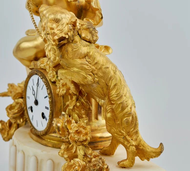 Phillipe Mourey. Mantel clock Putti with a dog. 