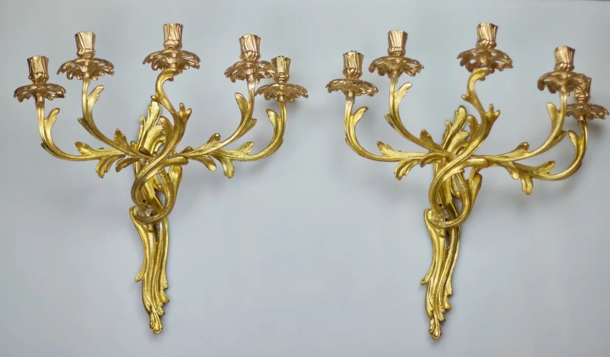A pair of bronze sconces