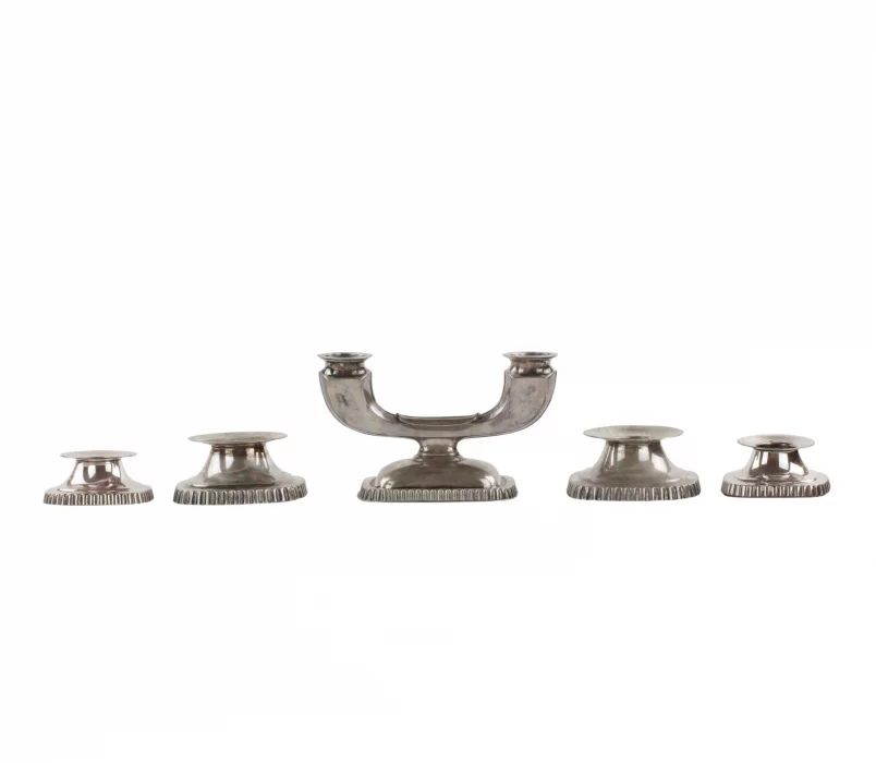 Set of five silver candlesticks in Art Deco style. 