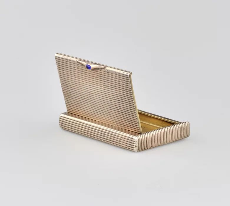 Silver cigarette case.