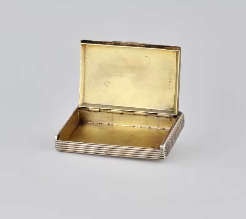 Silver cigarette case.