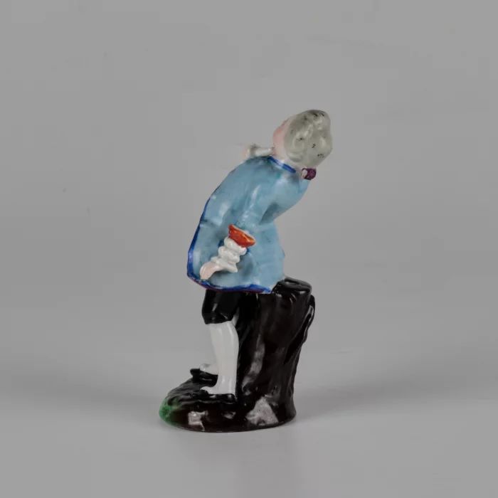 Porcelain figurine of a poet.