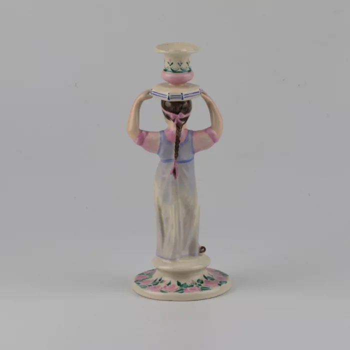 Porcelain candlestick-figure Russian peasant woman.