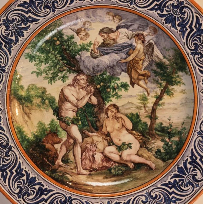 A dish of Italian majolica "Expulsion from Paradise".