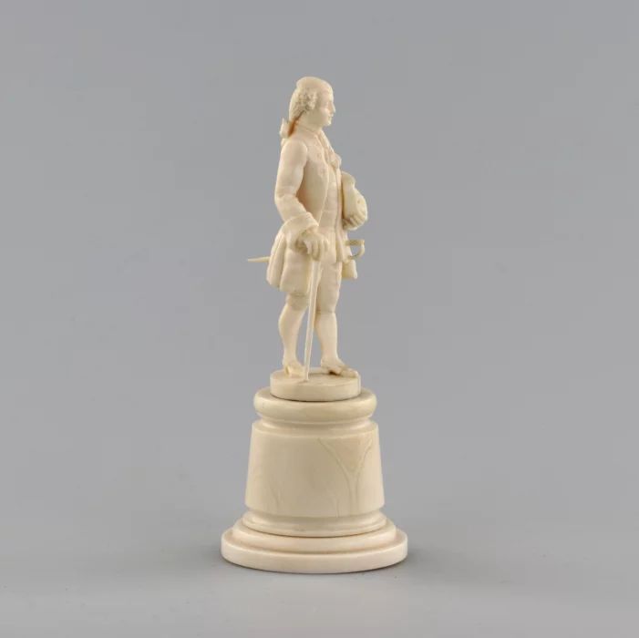 Ivory figure of a gentleman in a cocked hat.