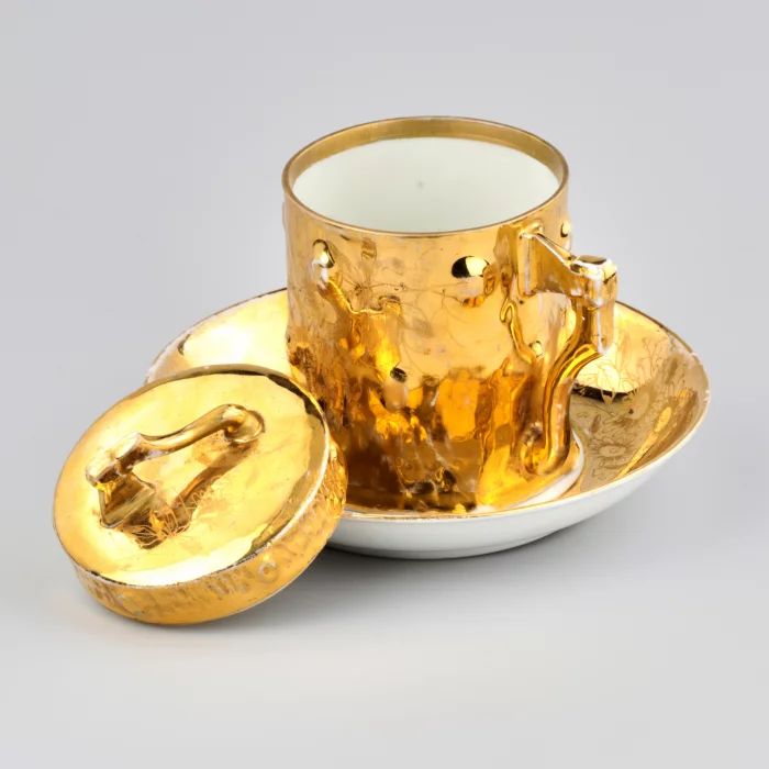 A pair of tea with a lid in the form of a hemp with an ax. Kuznetsov.