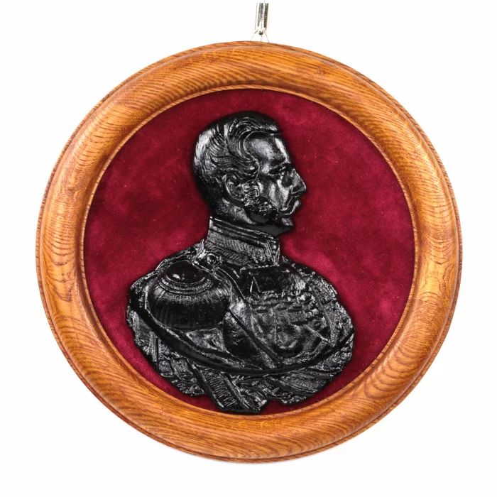Панно с чугунным барельефом императора Александра II.