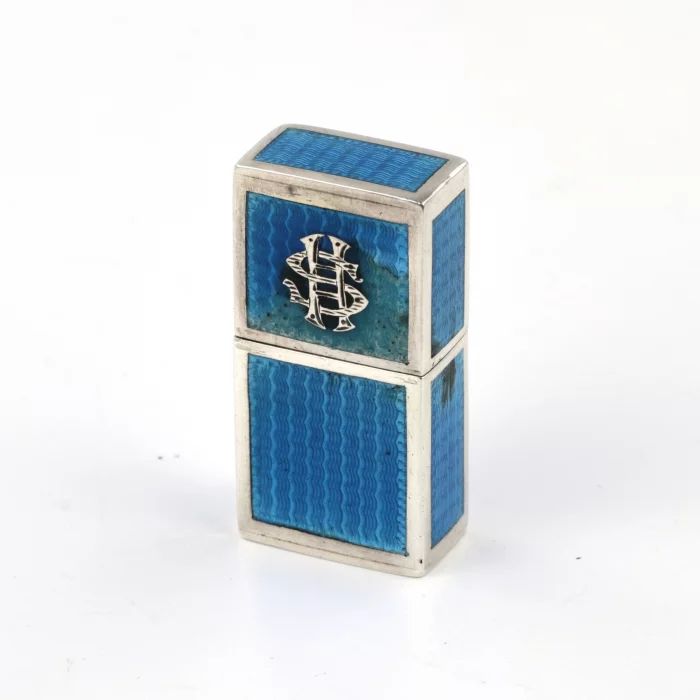 Miniature ladies lighter made of silver with guilloche enamel. 