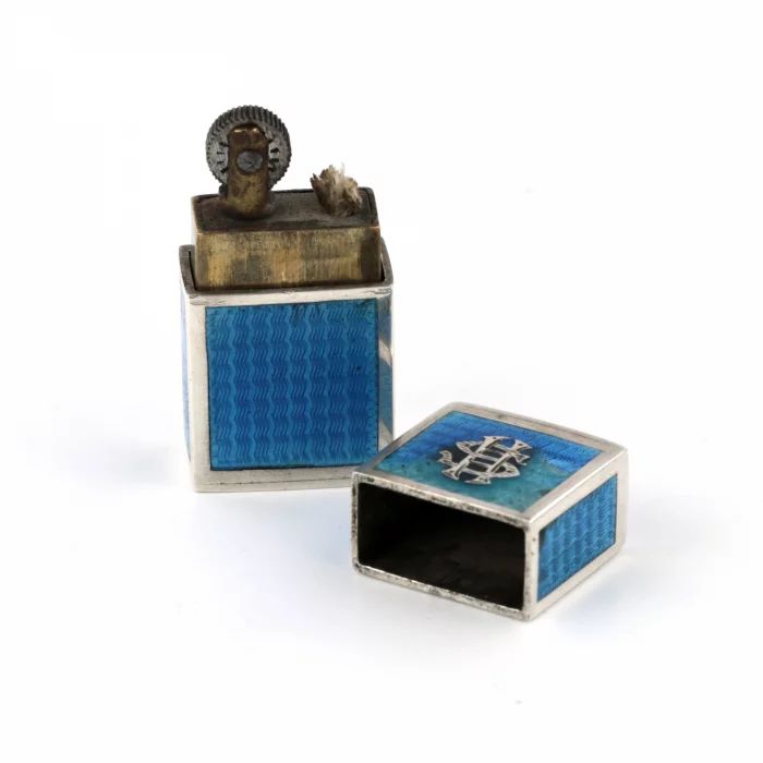 Miniature ladies lighter made of silver with guilloche enamel. 