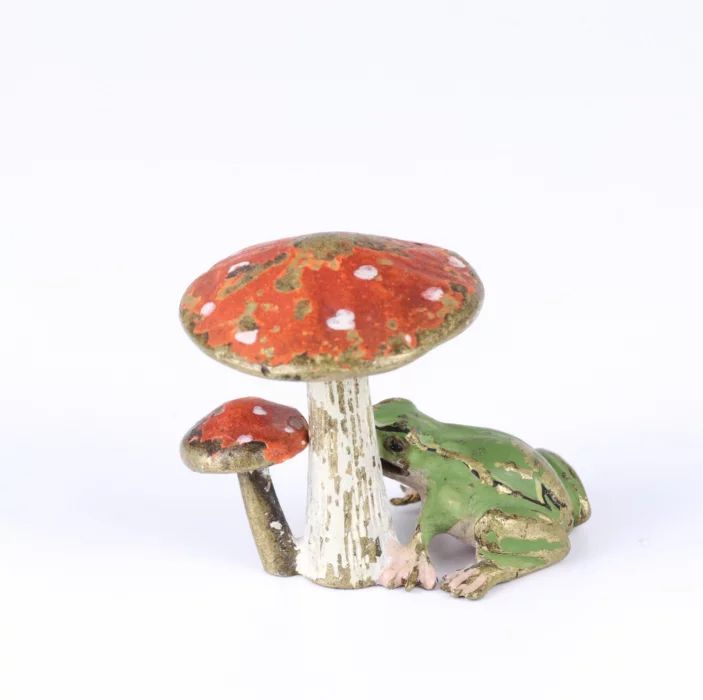 Frog under a fly agaric. Vienna bronze 