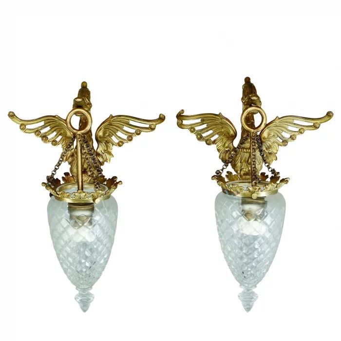 Pair of gilded bronze sconces with shades, first third of the 19th century. 