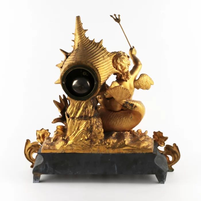 Mantel clock Putti on a dolphin