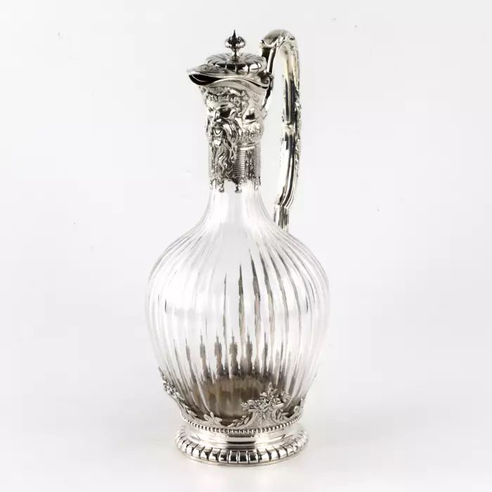 Silver wine jug in 16th century austere male dress. 