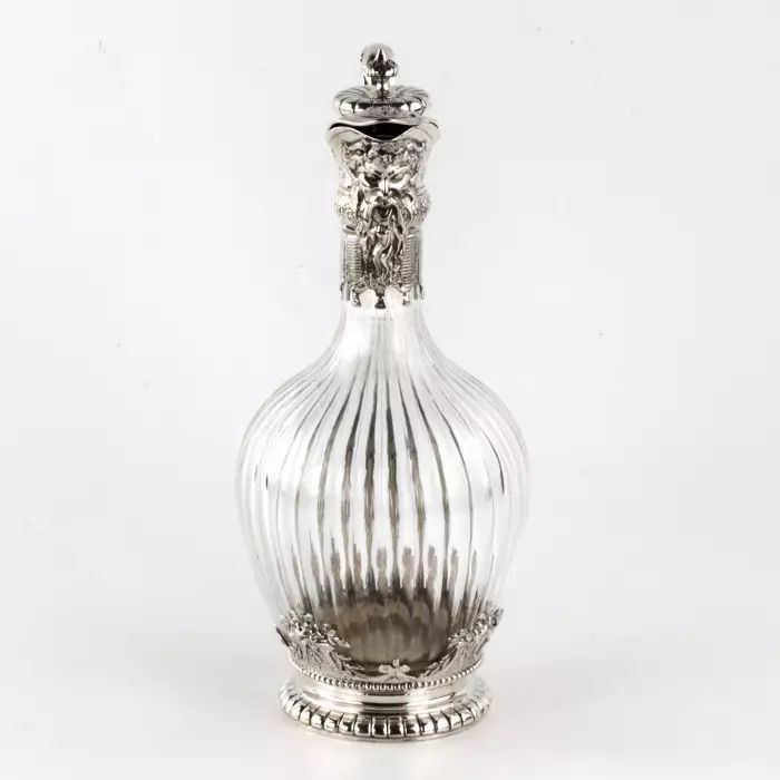 Silver wine jug in 16th century austere male dress. 