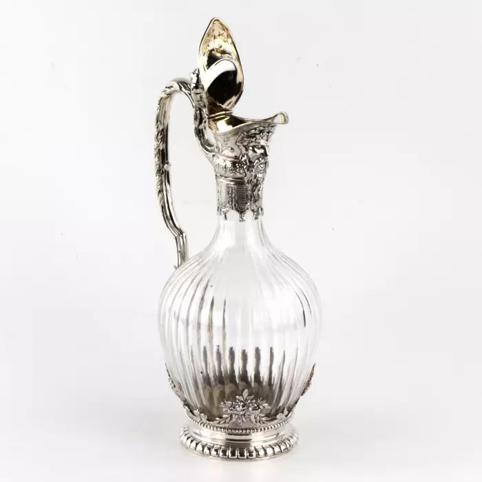 Silver wine jug in 16th century austere male dress. 