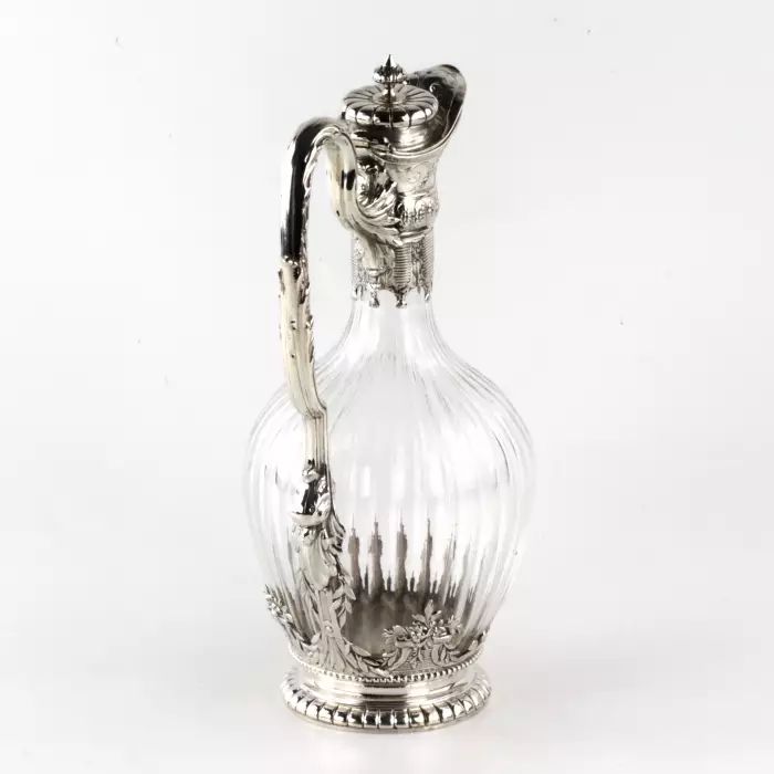 Silver wine jug in 16th century austere male dress. 