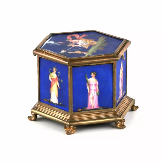 Brass box with muses, on porcelain panels. 