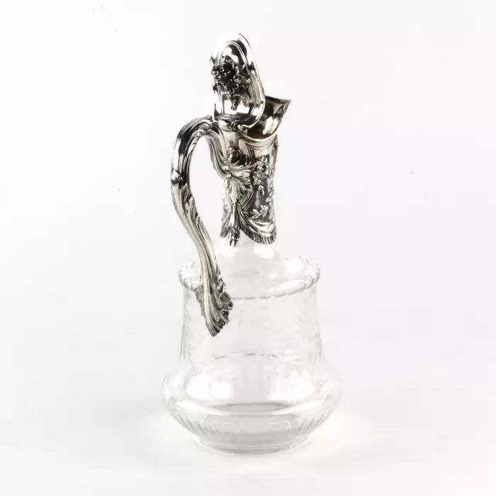A jug for wine, glass with silver. 
