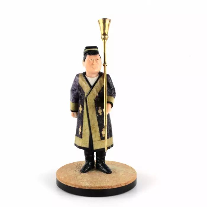 Figurine of an Uzbek in national costume with Kornai. 