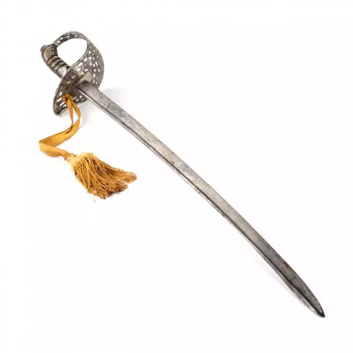 A cavalry broadsword with a carved steel hilt. 