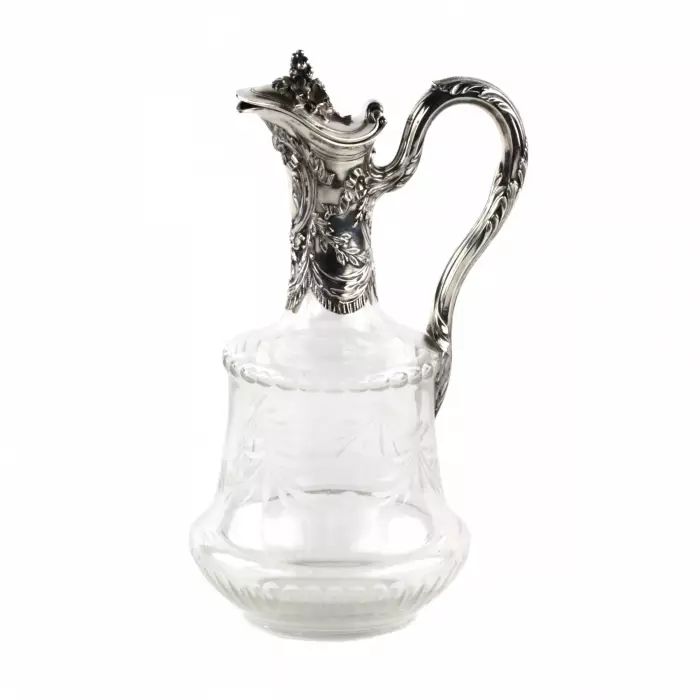 A jug for wine, glass with silver. 
