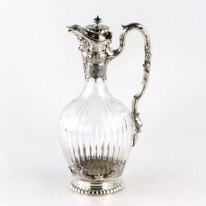 Silver wine jug in 16th century austere male dress. 