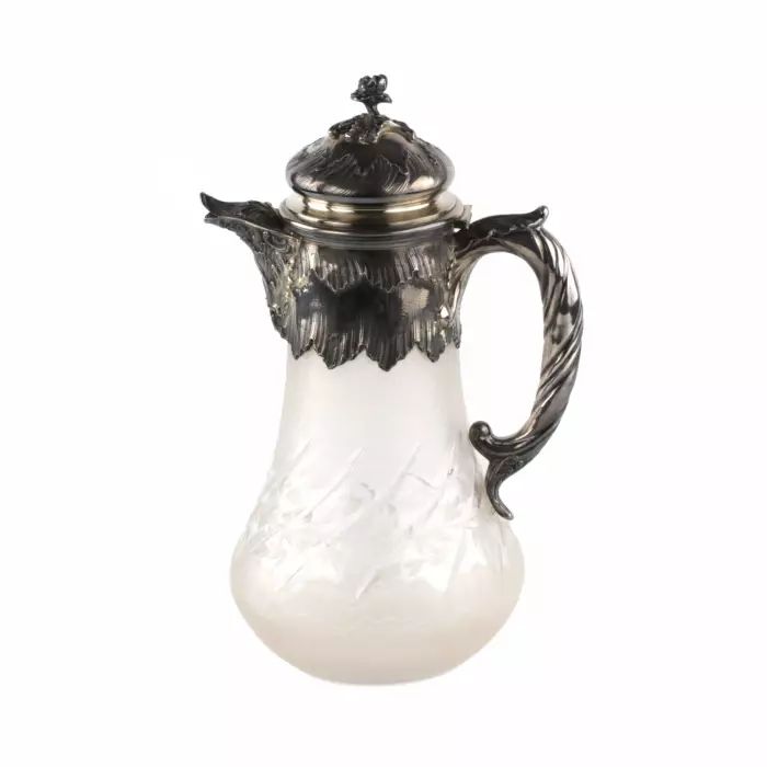 Silver water jug with engraved glass. 