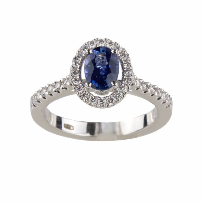 White gold ring with blue sapphire and diamonds. 