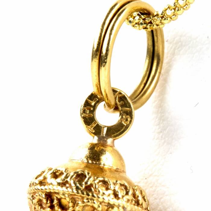 Pendant on a chain with stones. 