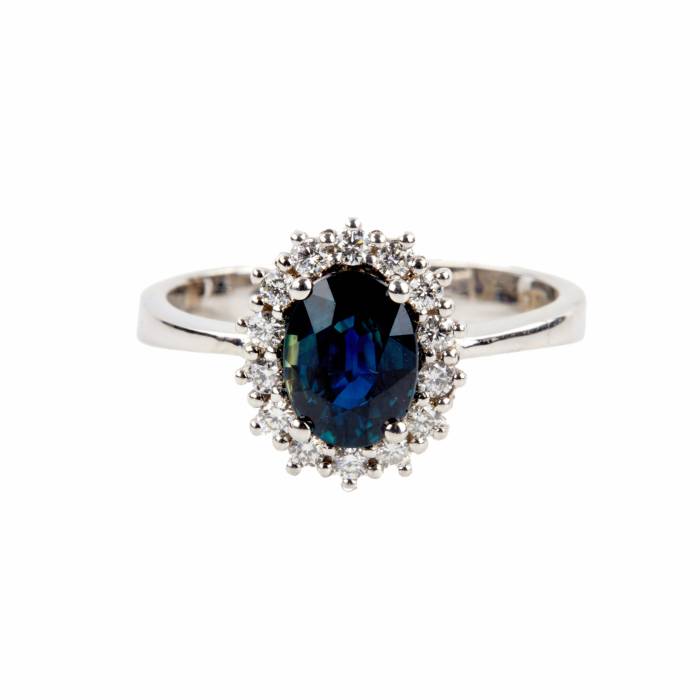 White gold ring with blue sapphire and diamonds. 