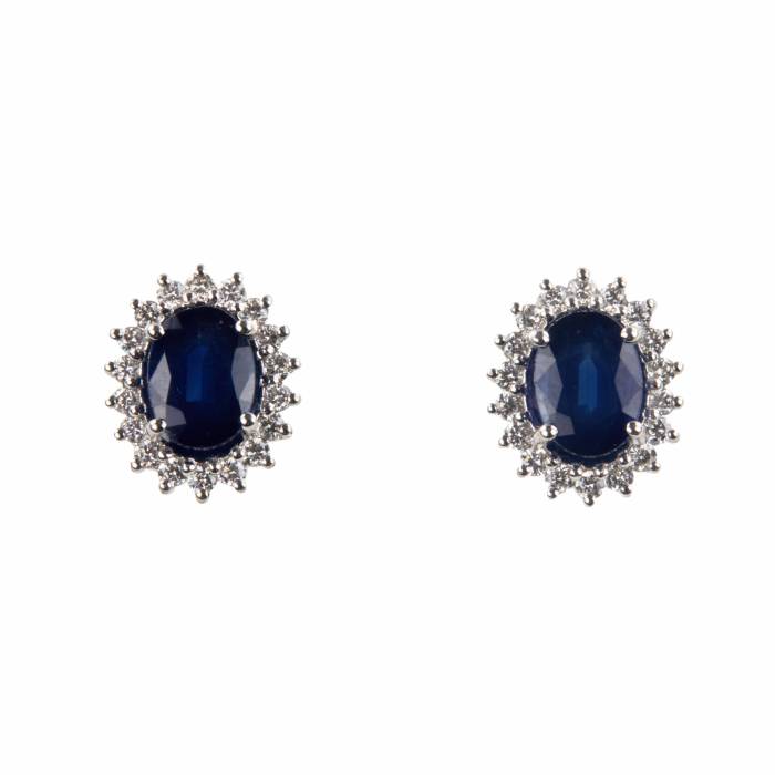 White gold earrings with blue sapphires and diamonds. 