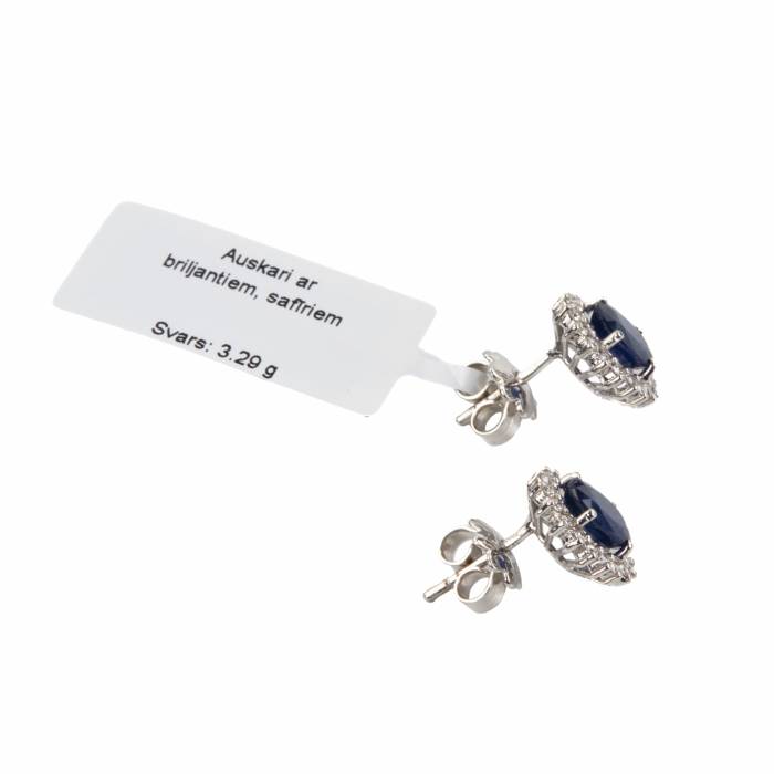 White gold earrings with blue sapphires and diamonds. 