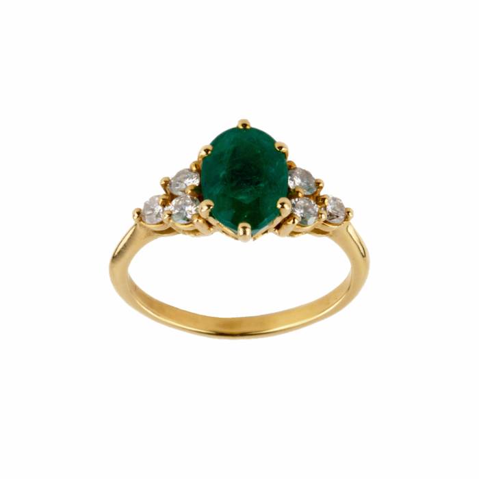 Gold ring with emerald and diamonds. 