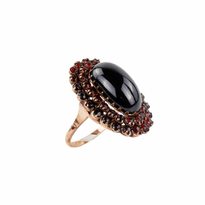 Golden ring with garnets. 