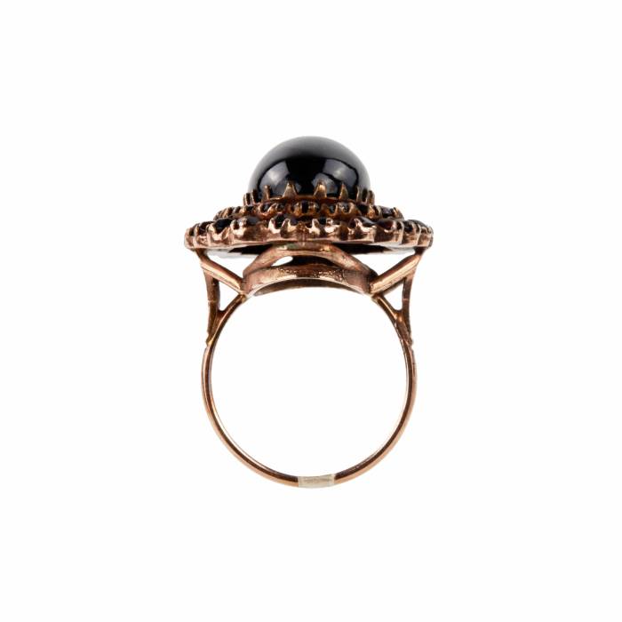Golden ring with garnets. 