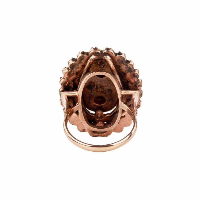 Golden ring with garnets. 