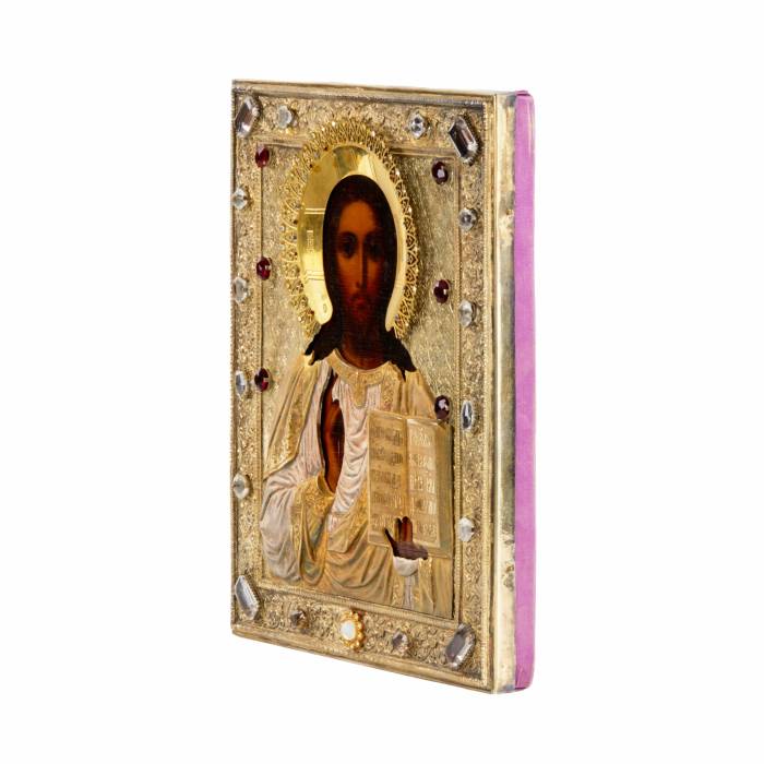 Icon of the Almighty in a gilded, silver frame with stones. 
