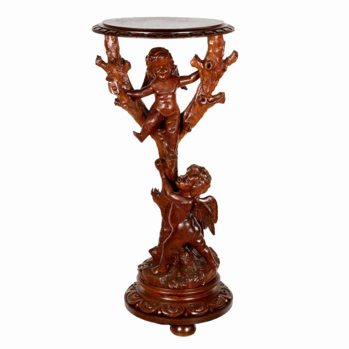 Wooden console with carved cupids. 
