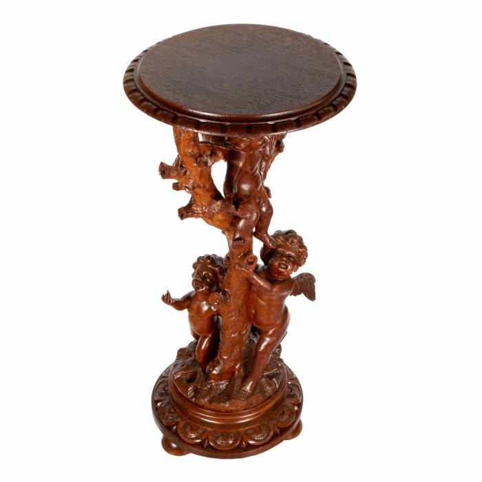 Wooden console with carved cupids. 